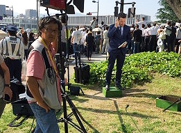 Tomoo ITOH of ITM filming a live transmission for a correspondent in Hiroshima.